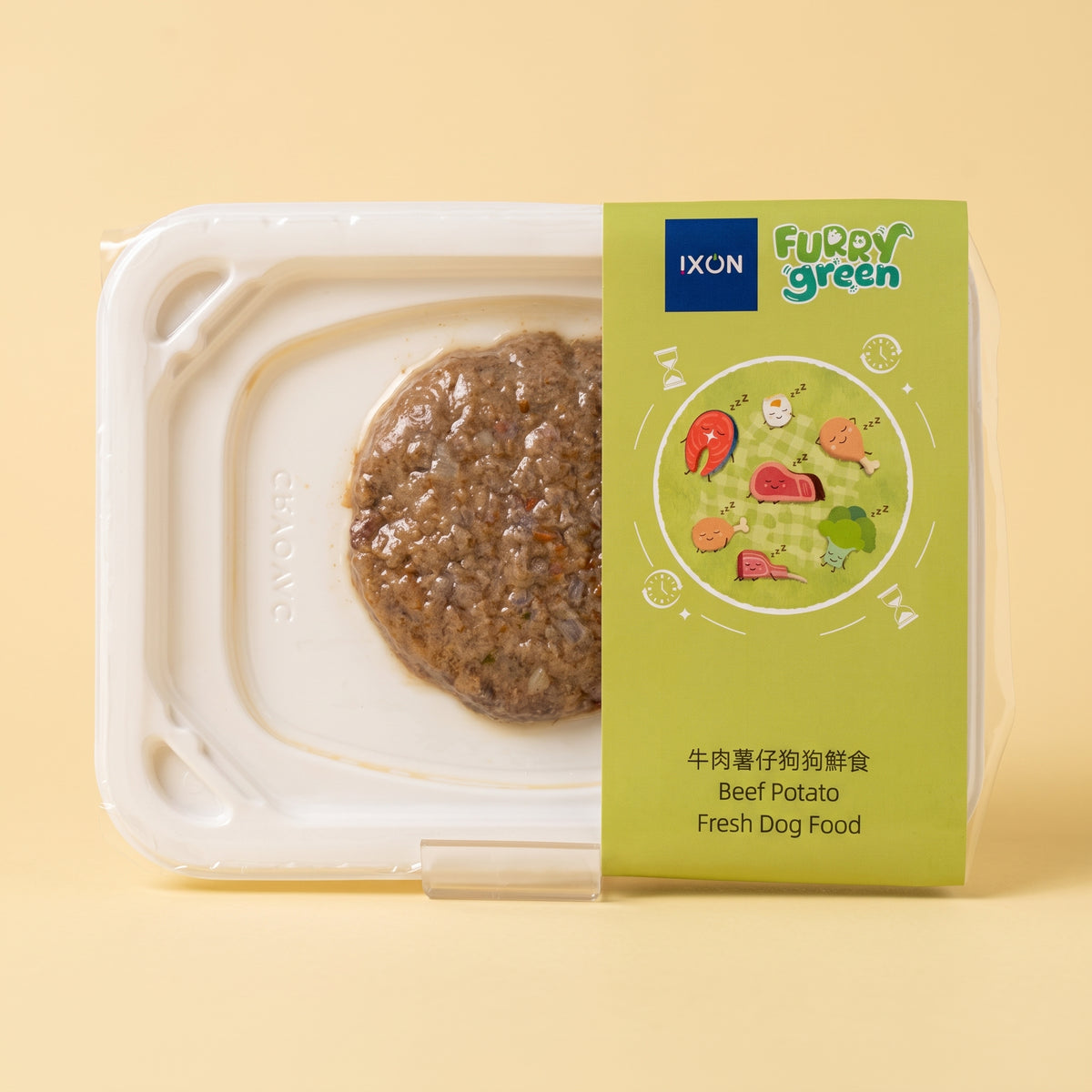IXON Furry Green Beef Potato Fresh Dog Food in a clear plastic tray with a light green label, set against a solid pale yellow background.